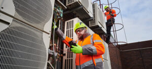 engineers servicing HVAC system